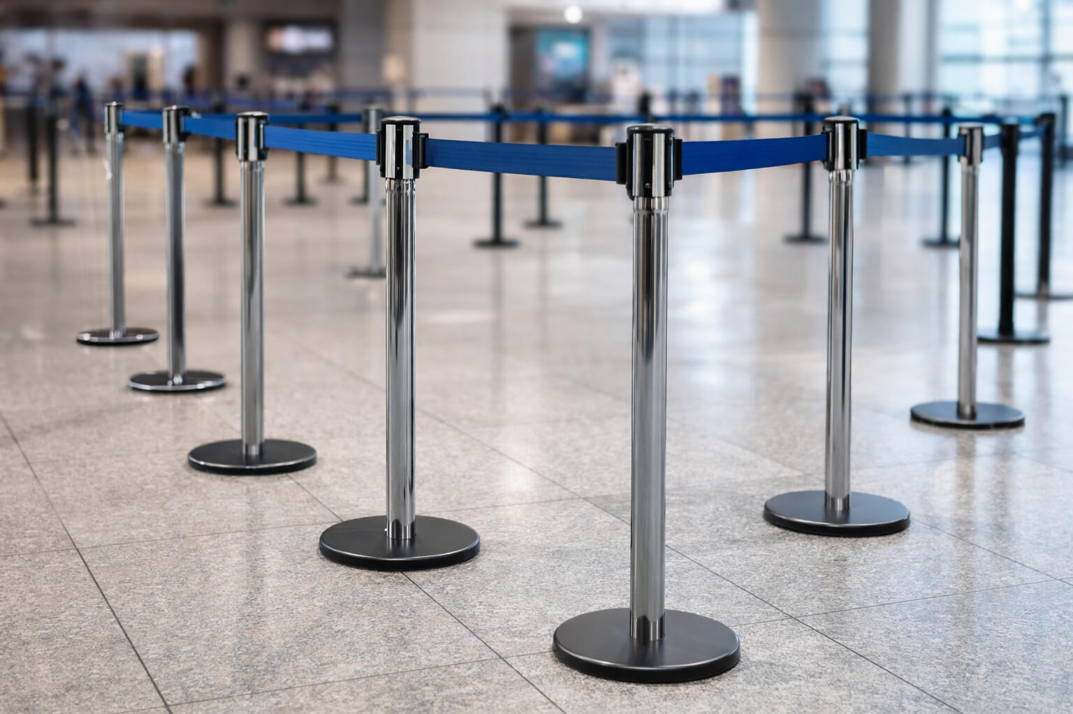 Retractable belt crowd control barriers for queue and line management