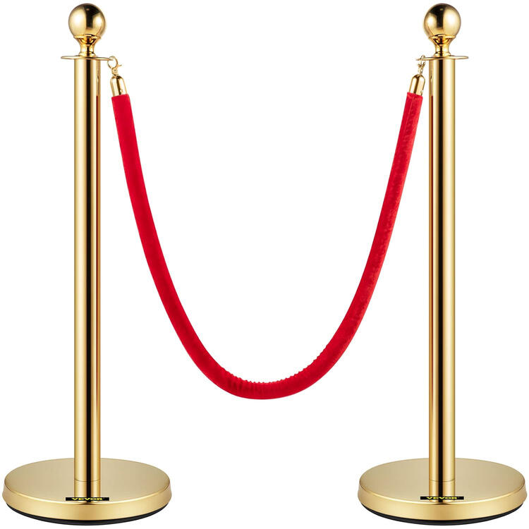 Gold stanchion posts with red velvet rope queue barrier