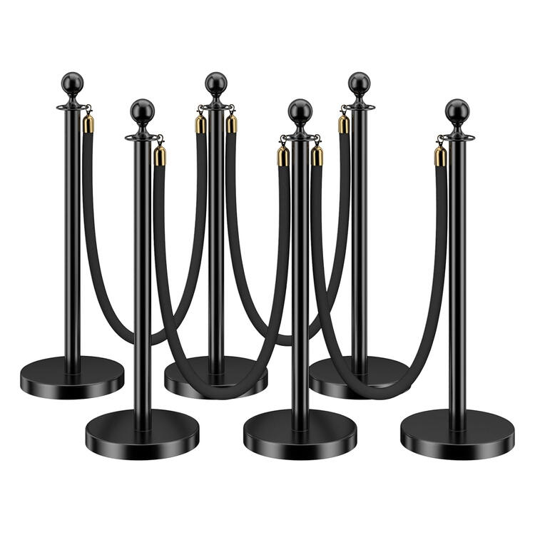 Black velvet rope stanchion barrier with gold posts
